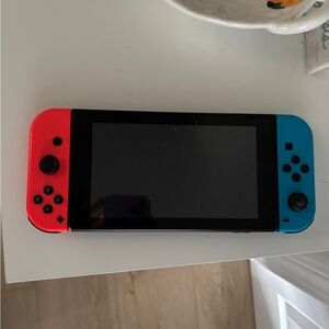 Nintendo switch- comes with charger for console and controllers and tv adapter
